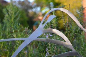 Close up photo of stainless steel garden sculpture